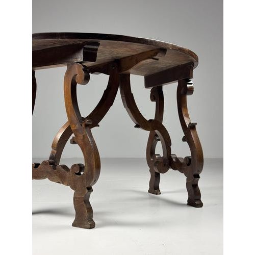 Set of two Italian Demi-Lune console tables. Crafted from walnut. Originating from Italy, circa 1800. Both are sturdy and...