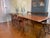 An imposing and large early 19th-century farmhouse table from France that extends into an even larger table. Made of...