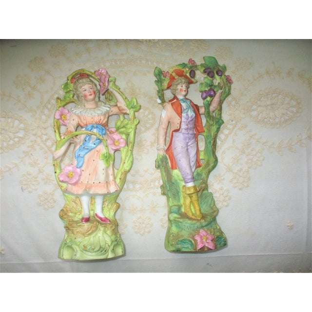 This is a Gorgeous Pair of Antique French Bisque Figurines of a Beautiful Young Maiden in a Bower of Flowers with Fabulous...