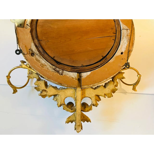 This convex mirror dates from the English Regency period circa 1820 The crowing point of the mirror is a recumbent stag...