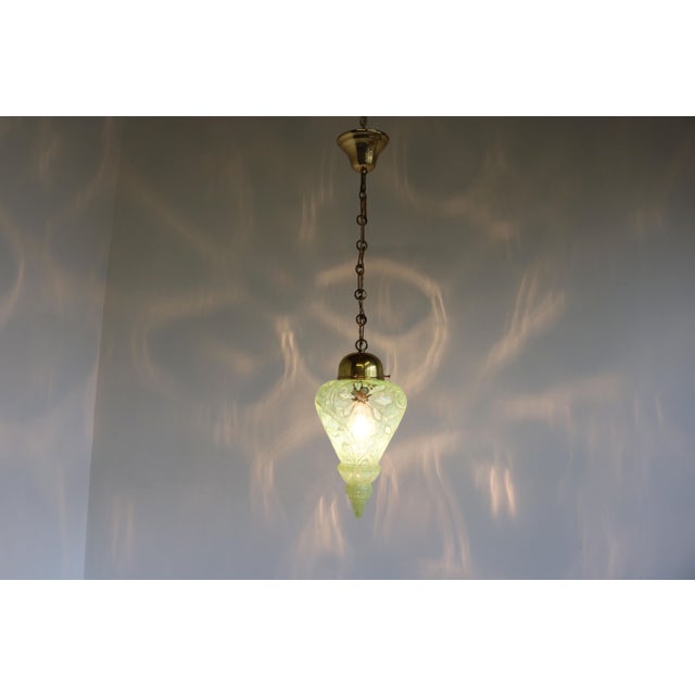 Rare Arts & Crafts brass hanging lamp with vaseline glass shade. Designed & produced by: Henry G. Richardson & Sons,...