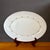 Vintage oval serving platter from the Wyndham “Buttercup” pattern. It features soft yellow and blue florals intertwined...
