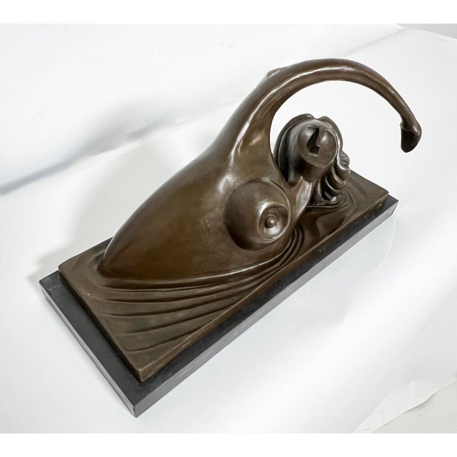 Bronze sculpture of a nude swimmer in motion, mounted on a granite base, by Wayne Current, from a limited edition of 30,...