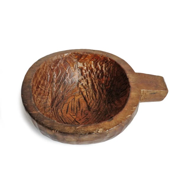 Antique handmade teak wood bowl with handle from Nepal. Warm natural wood finish and beautiful signs of age and use.