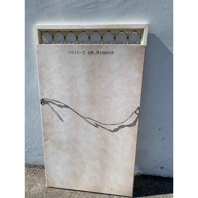 Fabulous vintage wall mirror that bears its original finish and great style.. Set an elegant white wood frame with pretty...