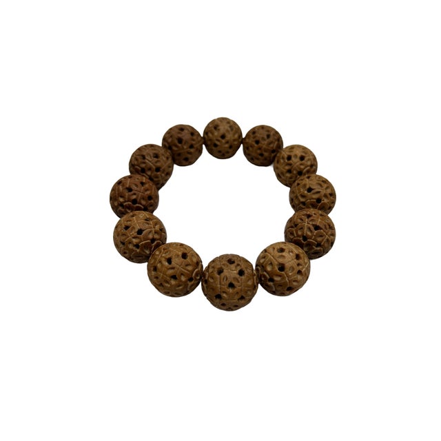 Immerse yourself in tranquility and timeless elegance with our exquisite sandalwood carved beads prayer rosary bracelet....