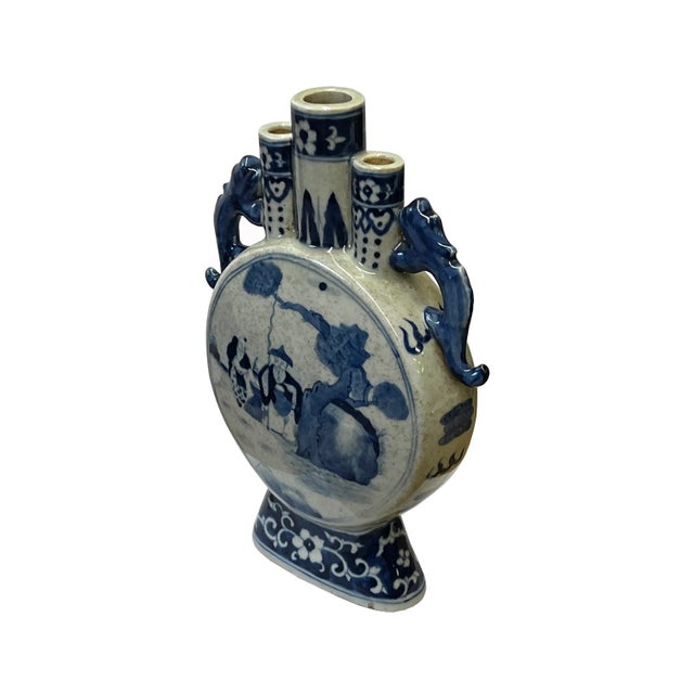 This is a Chinese decorative porcelain vase in a Blue and White color finish. The theme is an oriental people scenery...