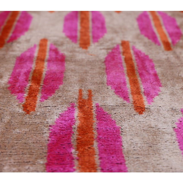 "Enliven your bespoke interiors with the high-energy sophistication of this hand-knotted silk velvet ikat lumbar pillow....