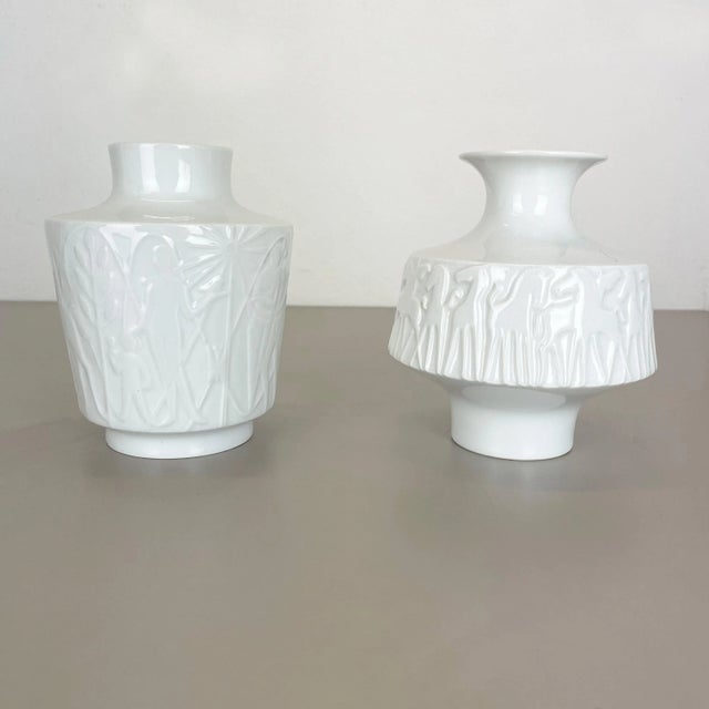 Op Art porcelain vases set of 2 Producer: Edelstein Bavaria, Germany Age: 1970s This original vintage OP Art Vase set was...
