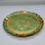 A round Florentine gilt tray, made in Italy. Crafted in wood with a softly antiqued gold finish, this piece features...