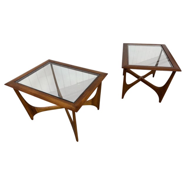 Stunning pair of Mid-Century Modern walnut and glass side tables from the highly desirable Silhouette collection by Lane...