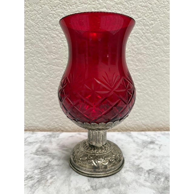 Ruby red vintage hurricane glass vessel for a candle or a vase. Textured cut glass on a silver etched pedestal base....