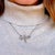 A stunning witness to the Art Nouveau era (circa 1910), this exquisite pendant is masterfully crafted in solid platinum....