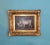 Oil painting on canvas depicting rustic scene. Rustic scene depicting two white-coated cows one of which is lying down and...