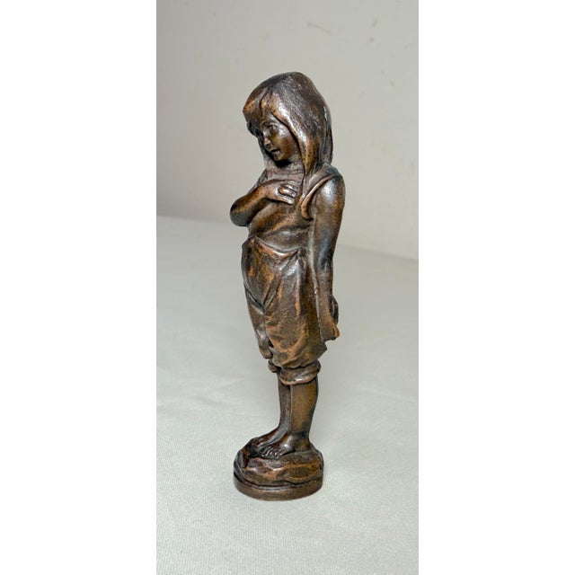 This antique 19th century figural bronze little girl wax seal figure is a charming and unique collectible item. Crafted...