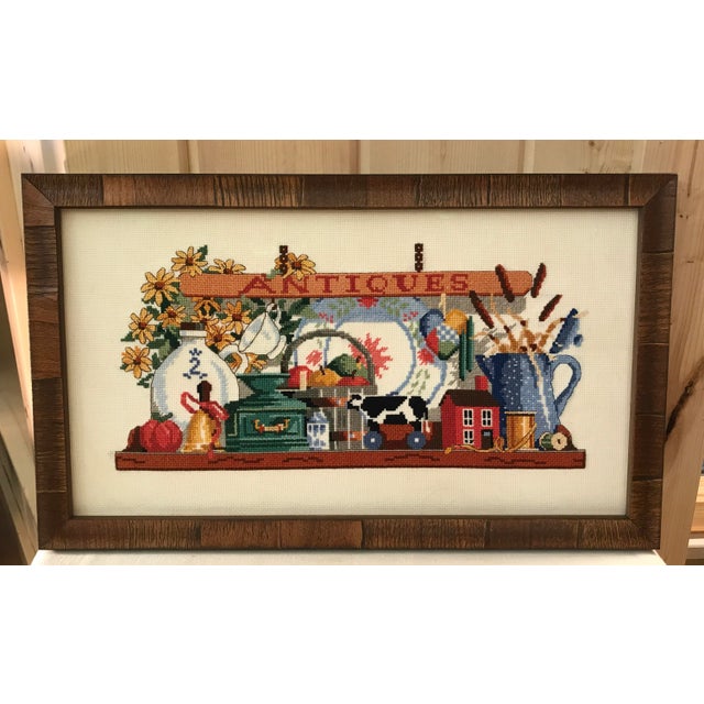 Nice vintage hand made counted cross stitch piece that has been recently professionally framed with art glass and wooden...