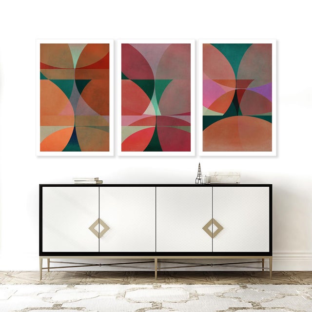 This mid-century modern geometric triptych art print set has stunning orange, pink and green colour throughout. Timeless...