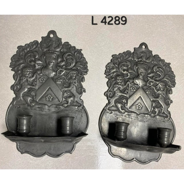 Pair of pewter candle sconces, in 17th century style cast with the Royal Coat of Arms. I am unsure of the age of these...