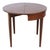 This antique Classical Hepplewhite style card table is crafted from mahogany and features intricate inlay work. The table...