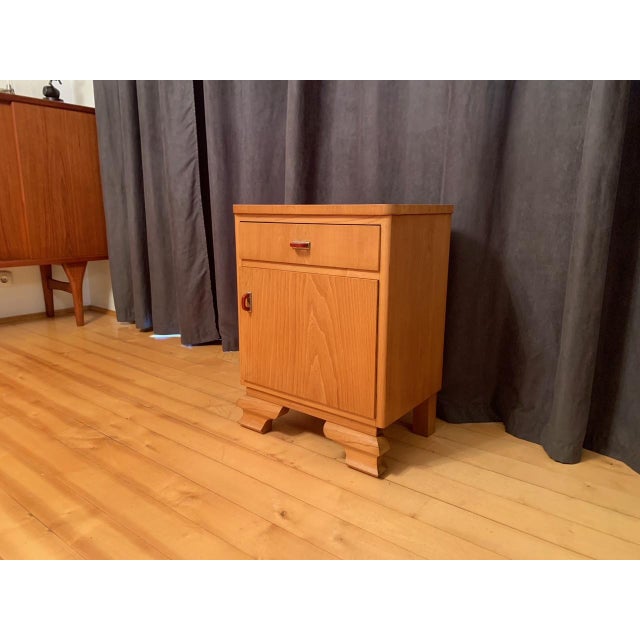 Art Deco cabinet from the 50's. In good condition. Attractive details in bakelite and nickel-plated metal. Fine...