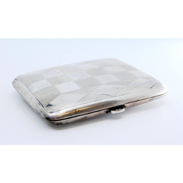 Silver Cigarette Case with High Relief on the Lid and Gold Interior., in Good conditions. Designed 1920 to 1949