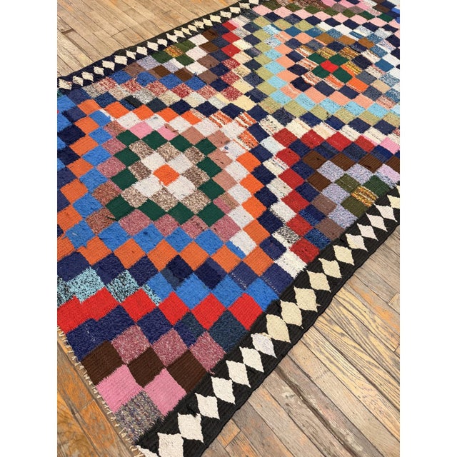 This mid-20th-century Turkish Village Kilim is a captivating testament to Anatolian regional textile artistry. Handwoven...