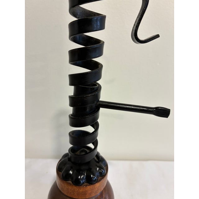 This handsome spiral candle holder is made in the style of a traditional courting candle, with a sculpted black iron coil...