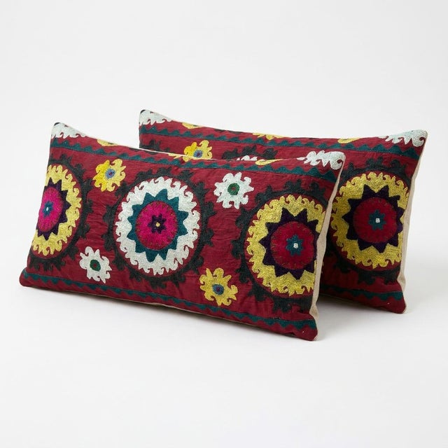 This beautiful 15'' x 31'' hand-embroidered Suzani pillow cover set was made from authentic Uzbek cotton fabric. The...