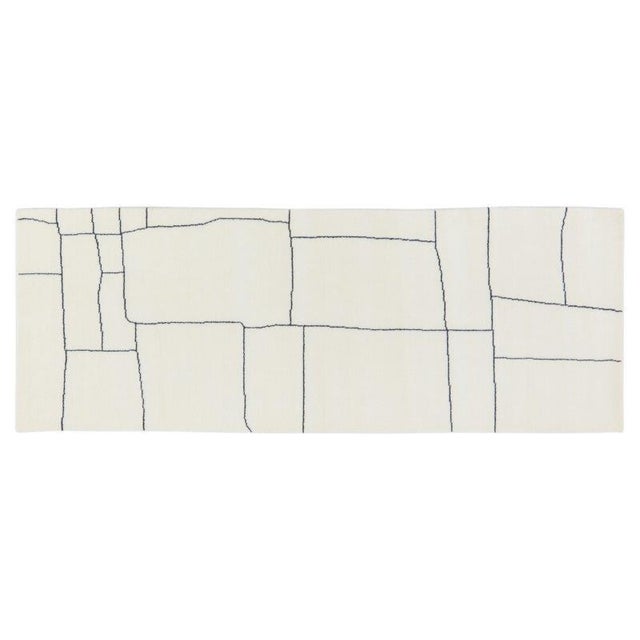 Hand-knotted with care using traditional rug-making techniques, this wool rug blends timeless craftsmanship with a modern...