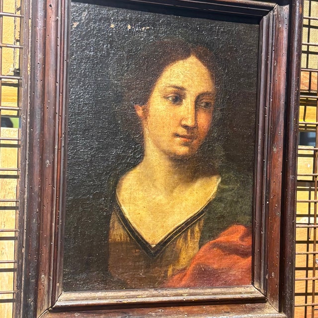 Antique painting, of fine quality, depicting a female face from the 17th century in a contemporary solid walnut frame....