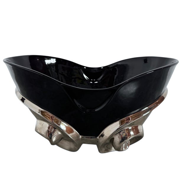 15”W x 8 1/4”H x 9 1/4”D This striking sculptural centerpiece is a quintessential artifact of the 1980s Postmodern...