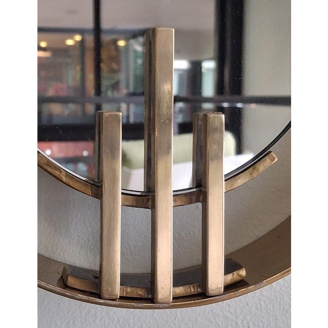 This 1960s oval Wall Mirror, crafted by Sant'Ambrogio De Berti, embodies the essence of Mid-Century design. Its brass...