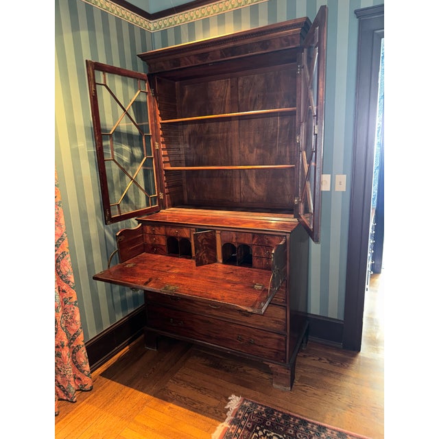 Mahogany ? chest with three glass enclosed display shelves above.. Three large drawers below. Two false drawers above fold...