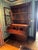 Mahogany ? chest with three glass enclosed display shelves above.. Three large drawers below. Two false drawers above fold...