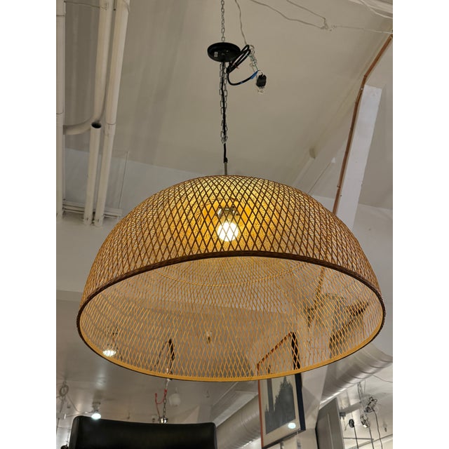 Design Plus Gallery presents the Bamboo M1 Pendant by AY Illuminate. The pendant showcases a braided bamboo shade formed...