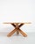 La Rotonda round-shaped table in walnut wood, designed by Mario Bellini in 1976 and produced by Cassina. La Rotonda table...