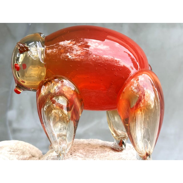 A rare and visually striking Murano-style glass bear sculpture in glowing amber and ruby red tones. Heavy hand-blown art...