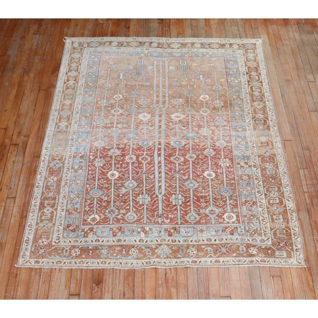 Warm colors set the tone for this Early 20th-century Tribal Afshar Rug circa 1910. Measures: 5'3" x 6'8".