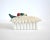 A vintage ceramic tin-glazed trinket box with side and lid of white and green palm frond leaves, with colorful palm...