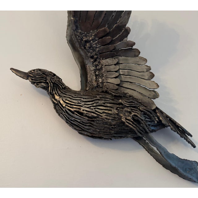 A beautiful 1970s brutalist carved steel duck in flight by French artist, Jacques Lerebourg . Signed