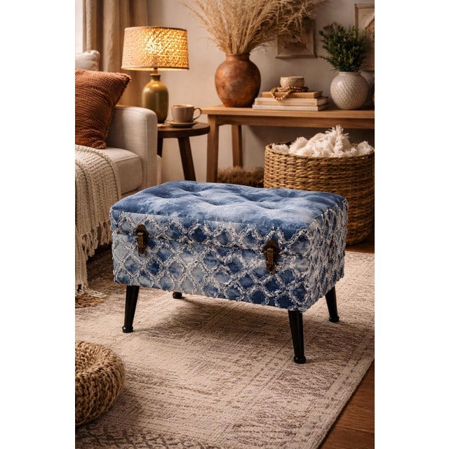 A distinctive and textural accent ottoman featuring an indigo tie-dye upholstered top with hand-finished character and a...