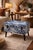 A distinctive and textural accent ottoman featuring an indigo tie-dye upholstered top with hand-finished character and a...