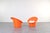 This set of two orange lounge chairs „Skopa” model was designed in the 1970s by renowned Danish designers Ole Gjerløv-...