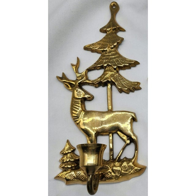 These Scandinavian style vintage brass candle sconces have a rustic theme of a deer with antlers and pine trees. They will...