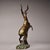 This decorative bronze sculpture depicts a dynamically posed antelope / goat with front legs raised. The body is adorned...