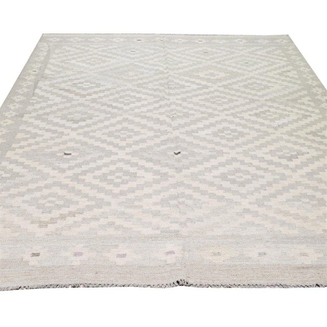 Flatweaved with care using traditional rug-making techniques, this wool rug blends timeless craftsmanship with a modern...