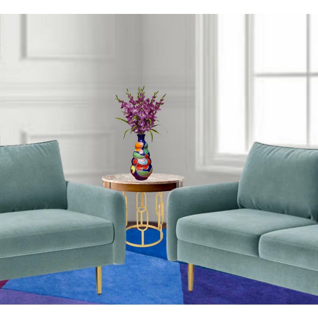 This striking 11-inch ceramic vase, handcrafted by artisans at La Musa Company in Italy, showcases a bold fusion of form...