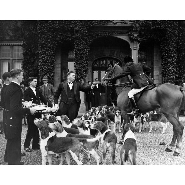 Stirrup Cup 28th February 1931: At Cowdray park, Midhurst, Sussex handing round a 'stirrup cup' at a hunt meet during...