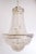 Nine-light crystal chandelier. The chandelier is in good vintage condition with signs of wear due to age. Dimensions: 24"...