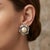These vintage 1950s Italian clip-on earrings capture the glamorous aesthetic of mid-century costume jewelry inspired by...